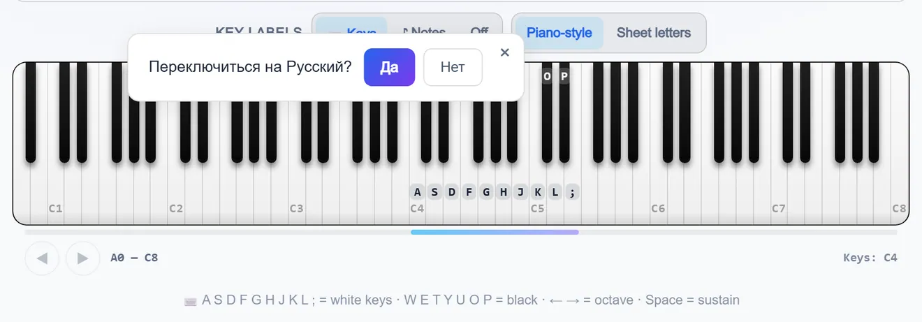 Piano keyboard with letter labels on the keys and the layout switch