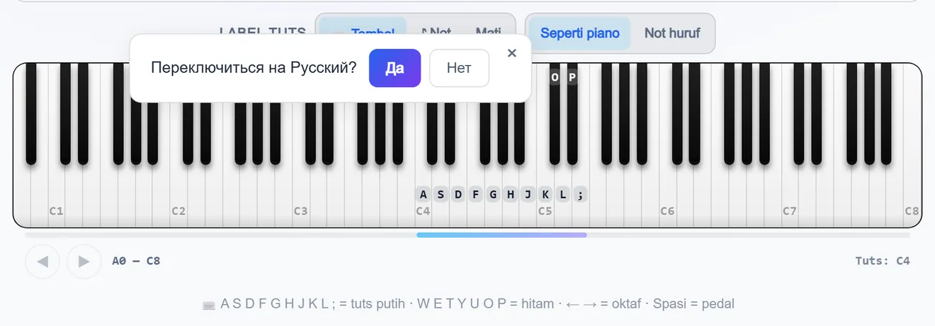 Papan tuts piano dengan huruf pada tuts dan pengalih susunan